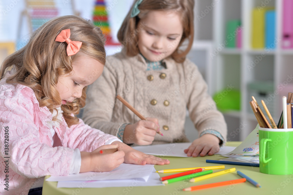 Two cute little girls drawing Two cute little girls drawing