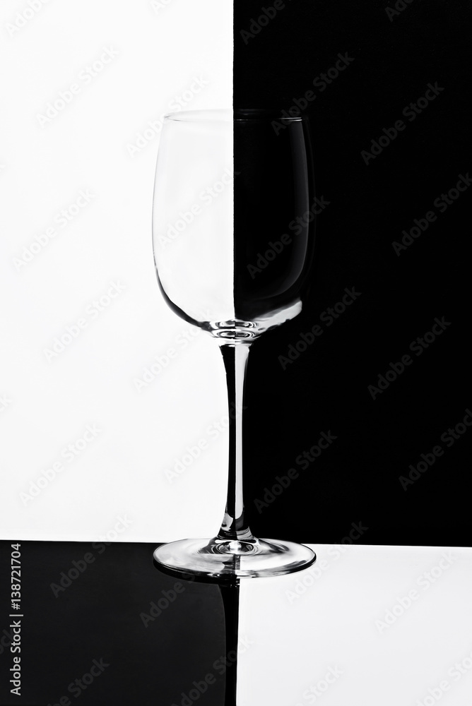 empty glass of wine on black and white background empty glass of wine on black and white background