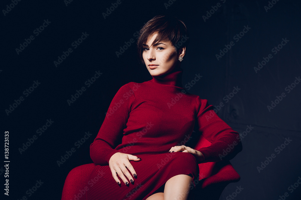 Attractive woman in red. Fashion portrait of a sexy young business