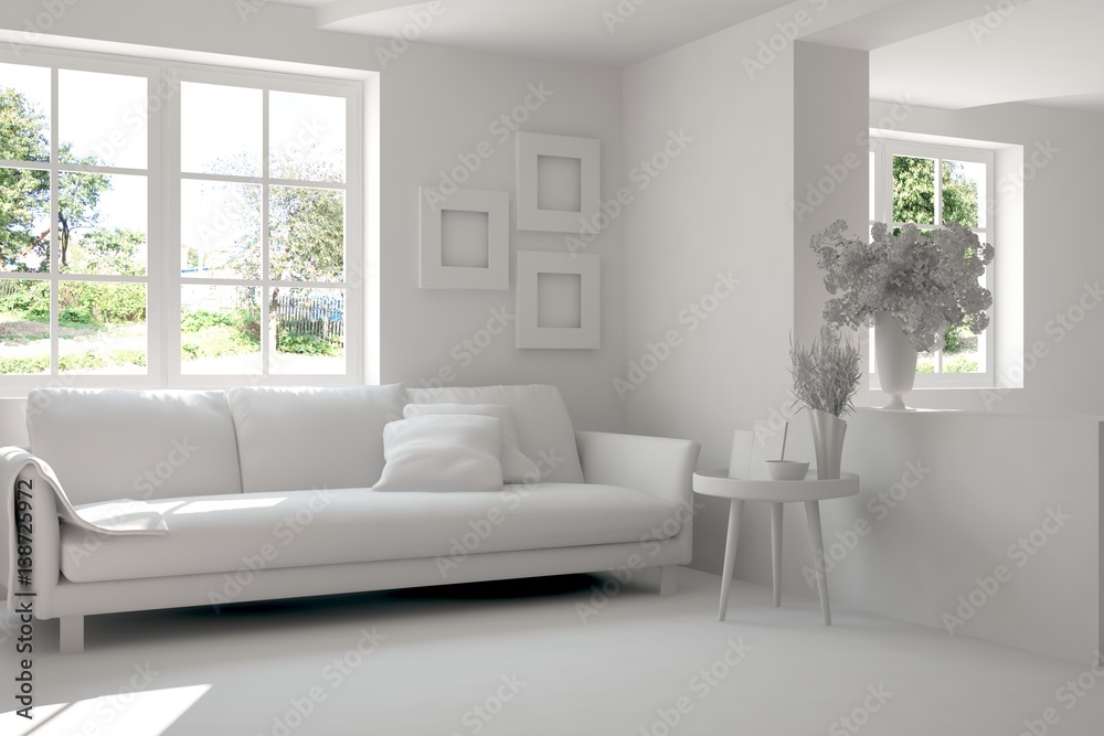 Fototapeta premium Grey room with sofa and green landscape in window. Scandinavian interior design