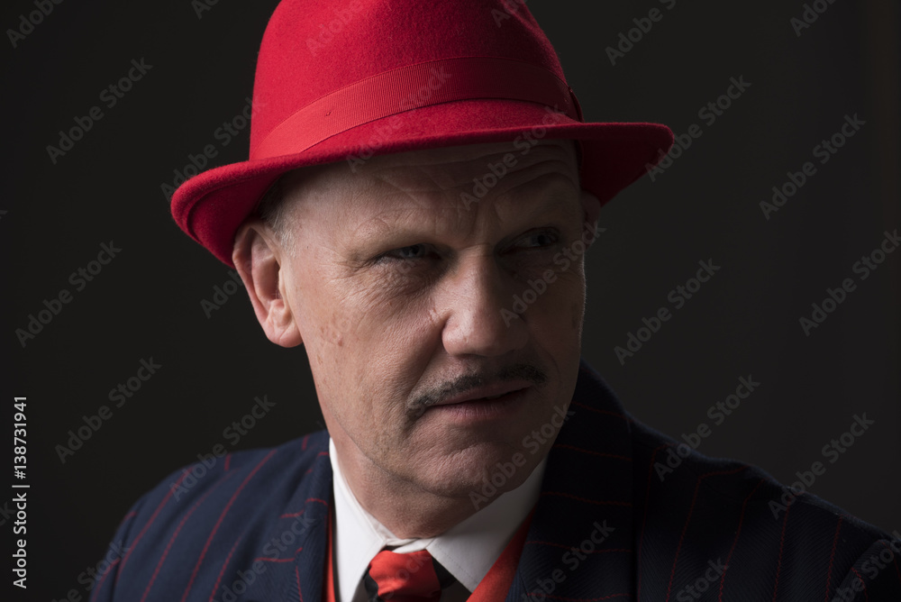 Portrait of a mature Jazz man on a black background.