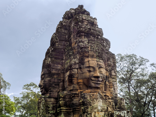 Bild auf Leinwand The gigantic face sculptures stone decoration of Bayon Temple in Angkor Thom, the 12th century city of Khmer Empire