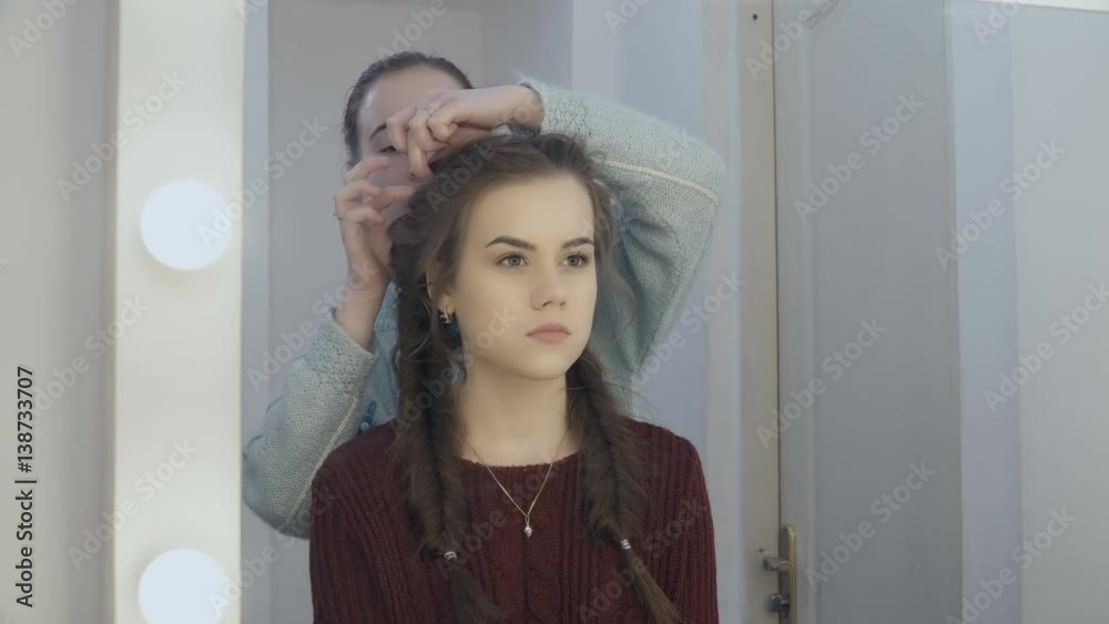 Beautiful young woman making hairstyle in salon Beautiful young woman making hairstyle in salon
