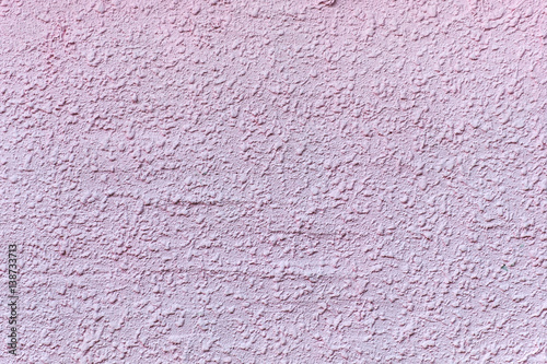 Relief plastered surface in muddy pinkish color. For background and texture.