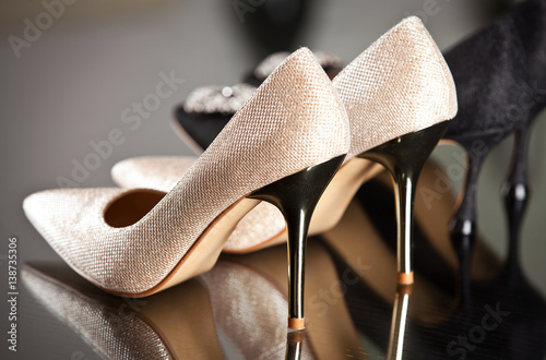 Background with beautiful shoes on shelves of shop. © abelena