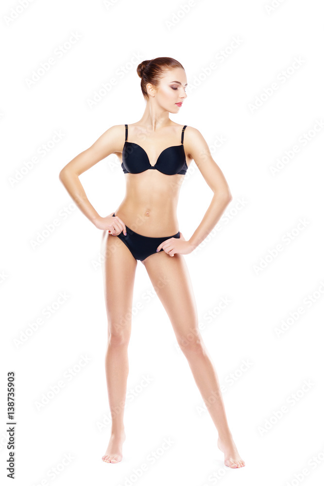 Fit, healthy and sporty woman in black underwear isolated on white. Sport, fitness, diet, weight loss and healthcare concept. Fit, healthy and sporty woman in black underwear isolated on white. Sport, fitness, diet, weight loss and healthcare concept.