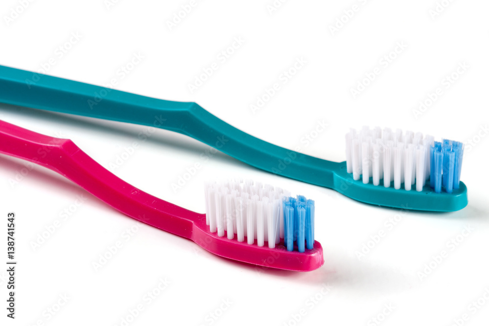 Two toothbrushes isolated on a white background closeup Two toothbrushes isolated on a white background closeup