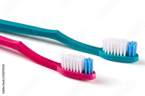 Two toothbrushes isolated on a white background closeup