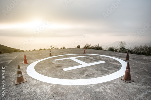 Cuadro en lienzo Heliport for helicopter on mountain,morning light