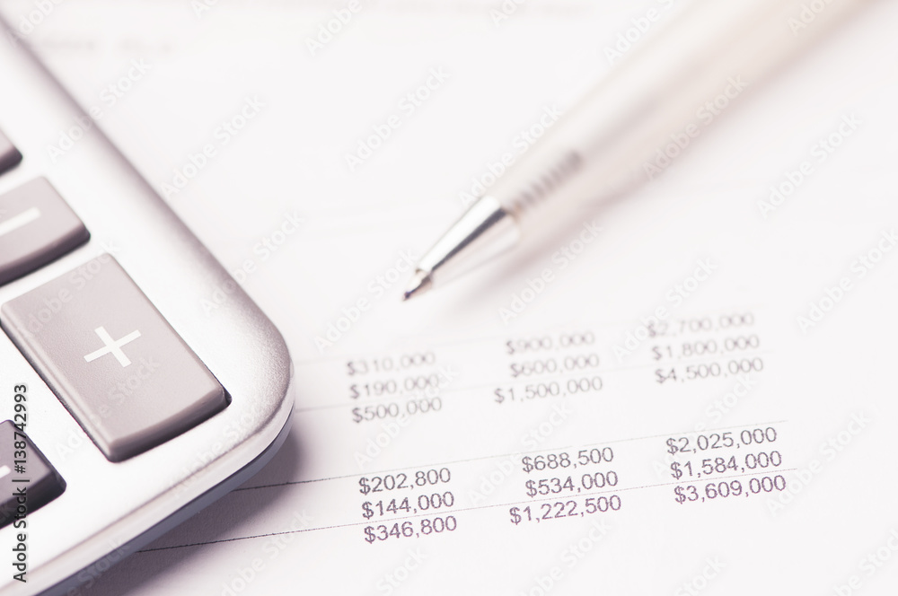 Financial paper charts and graphs on the table Financial paper charts and graphs on the table