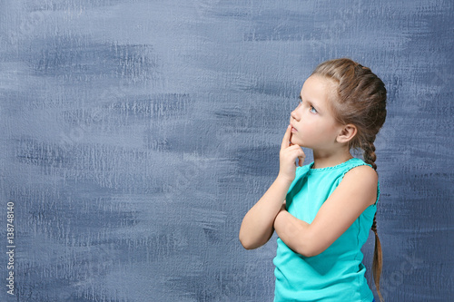 Cute little girl on color b...
