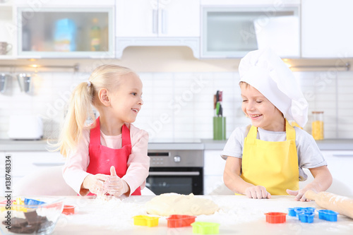 Little kids making biscuits...