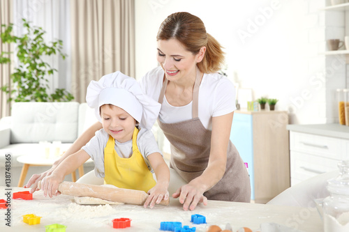 Young mother with son makin...