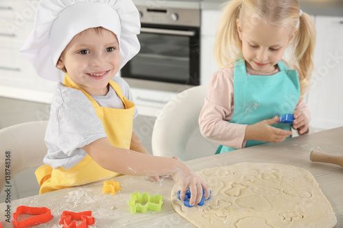Little kids making biscuits...
