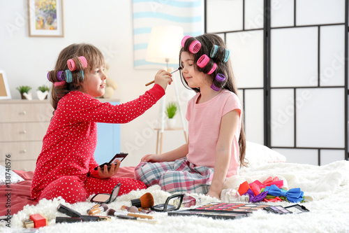 Cute little girls playing w...