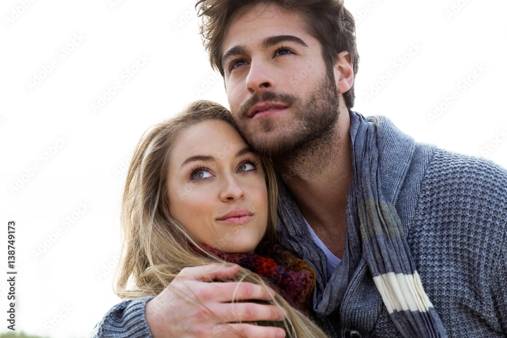 Beautiful young couple in love in a cold winter on the beach. Beautiful young couple in love in a cold winter on the beach.