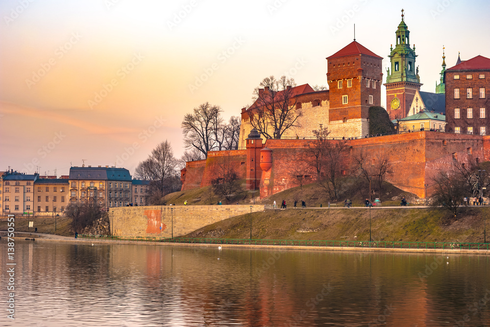 Royal castle of the Polish kings on the Wawel hill, over the Vistula river in beautiful sunset light, Krakow, Poland