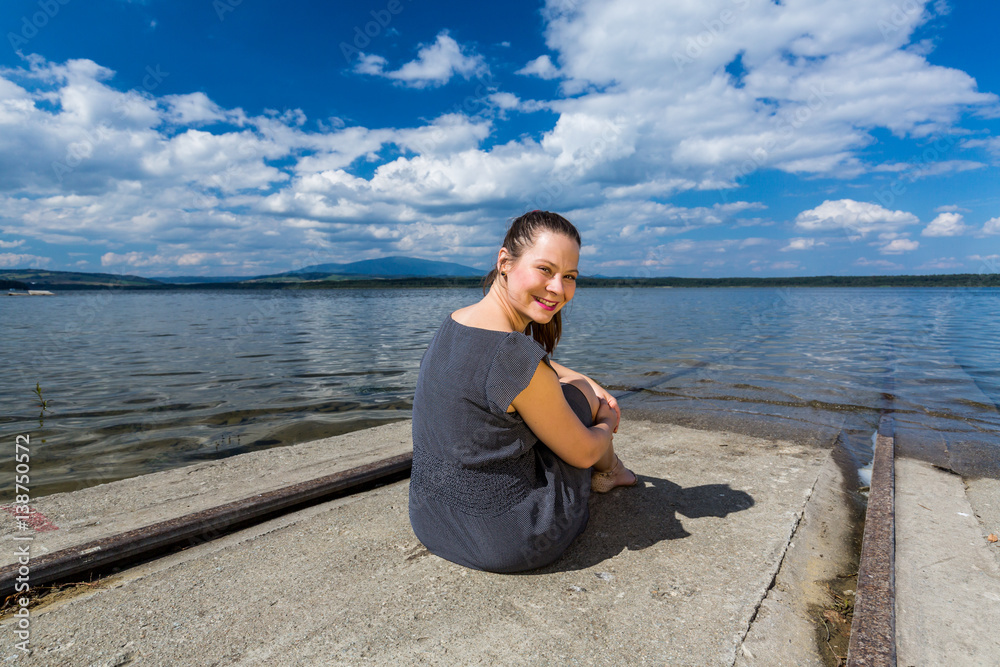 Girl at the barrier lake Oravska Priehrada in northern Slovakia