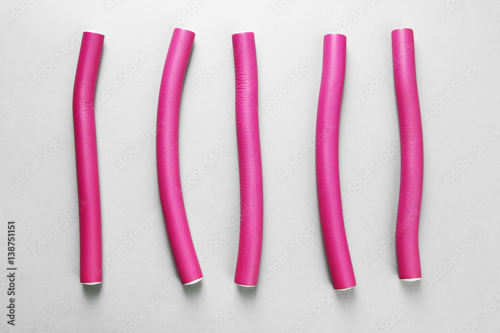 Curlers on grey background Curlers on grey background