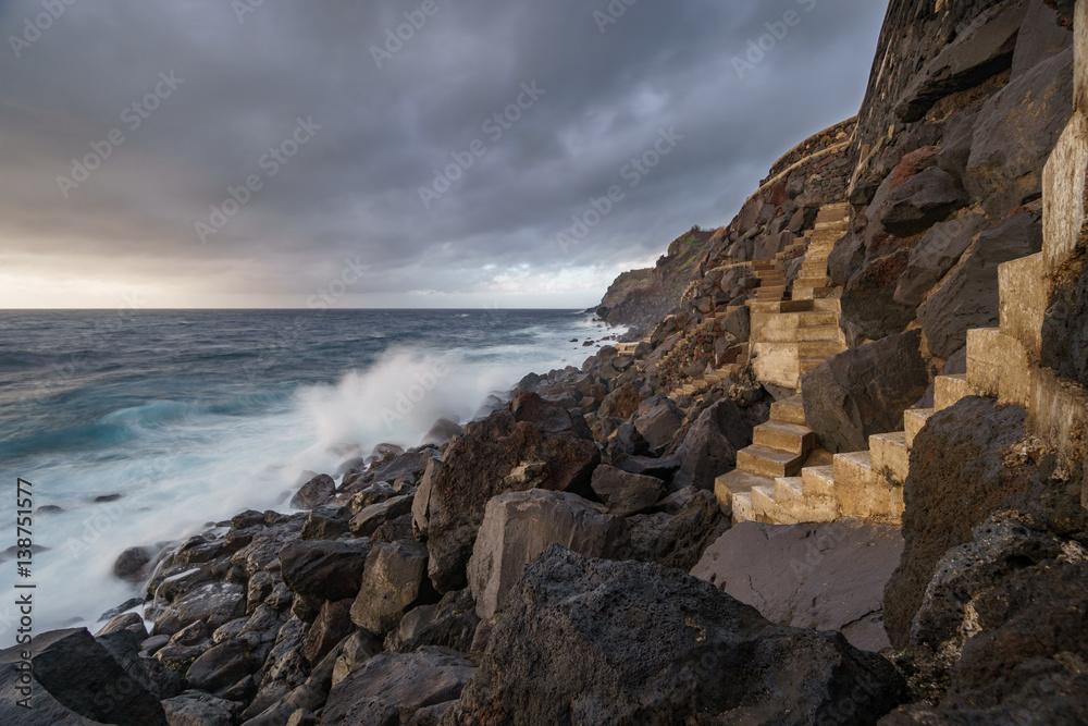 Terceira island coastline with stairs and waves breaking, long exposure
