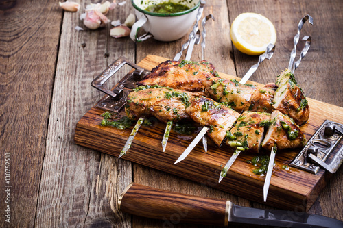Grilled chicken skewers with chimichurri sauce