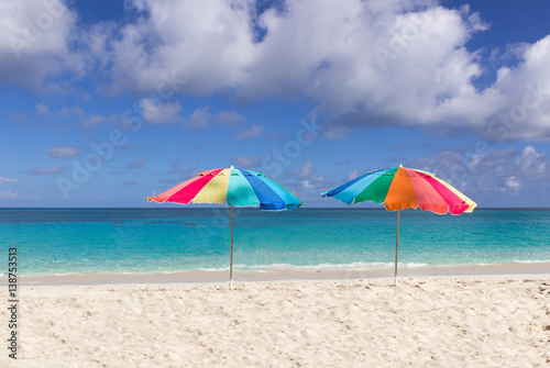 Two colorful beach umbrellas