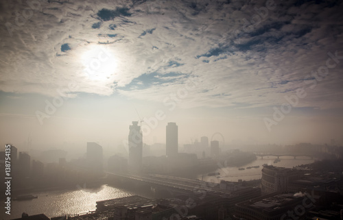 rooftop view over London on a foggy day from St Paul's cathedral, UK