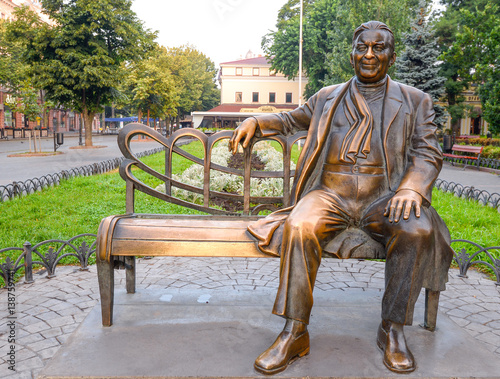 Odessa, Ukraine - July 20, 2016: Monuments to famous artist in Odessa garden. Bronze monument to Leonid Utesov in Odessa, Ukraine photo