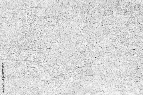 Weathered pale and aged concrete wall texture background in black&white. © tuomaslehtinen