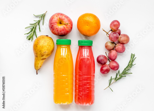 colorful plastic bottle with fruit on white background top view mockup