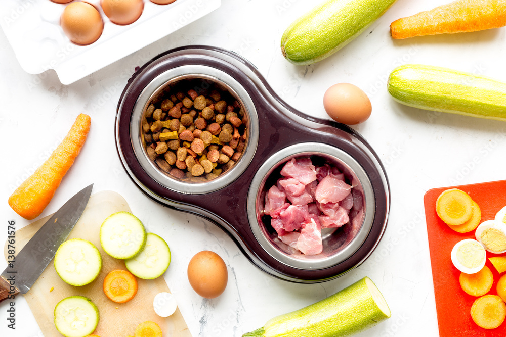 petfood set with vegetables and meat on kitchen table background top view petfood set with vegetables and meat on kitchen table background top view