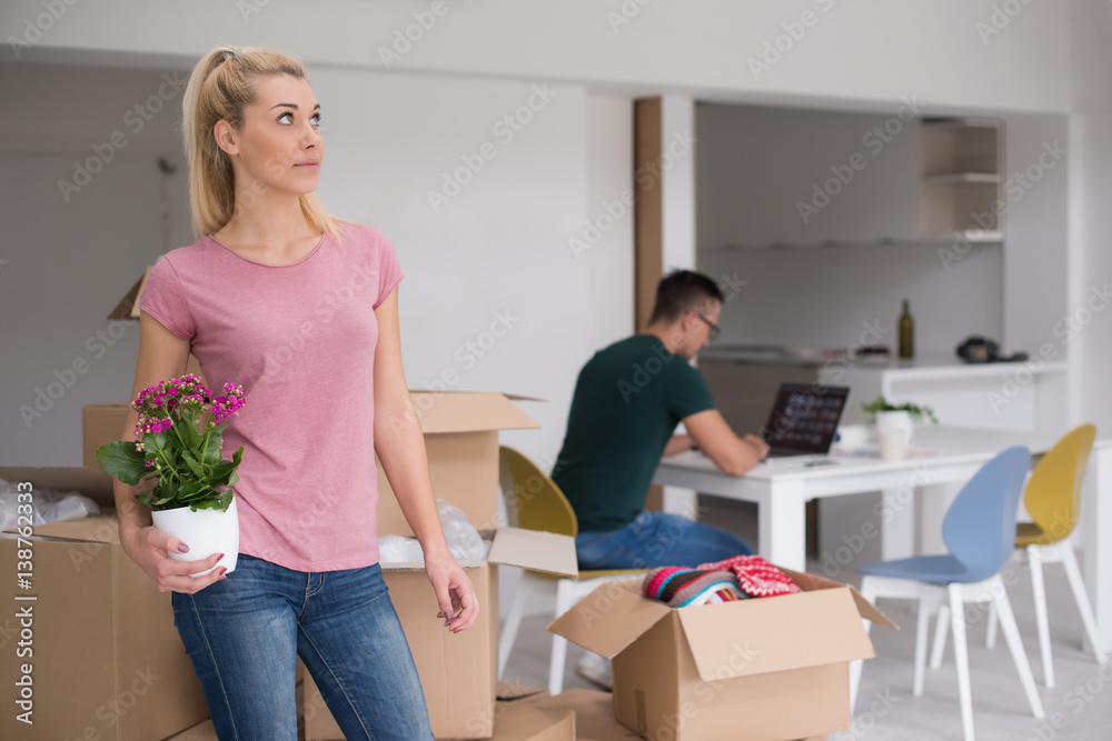 young couple moving into a new home young couple moving into a new home