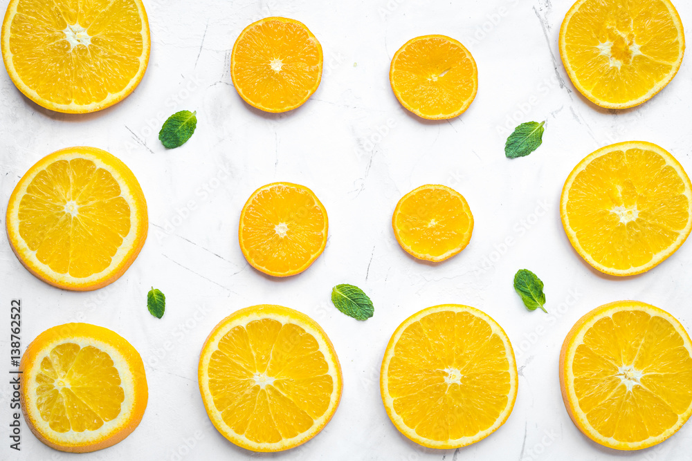 Orange slices with mint on white background top view pattern