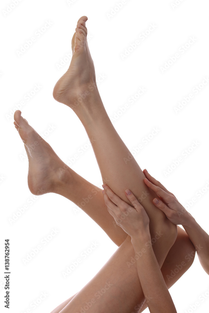 Beautiful, healthy and sensual woman enjoying in a smooth touch of her skin isolated on white background. Female legs Waxing, Hair Removal, Skin care concept Beautiful, healthy and sensual woman enjoying in a smooth touch of her skin isolated on white background. Female legs Waxing, Hair Removal, Skin care concept