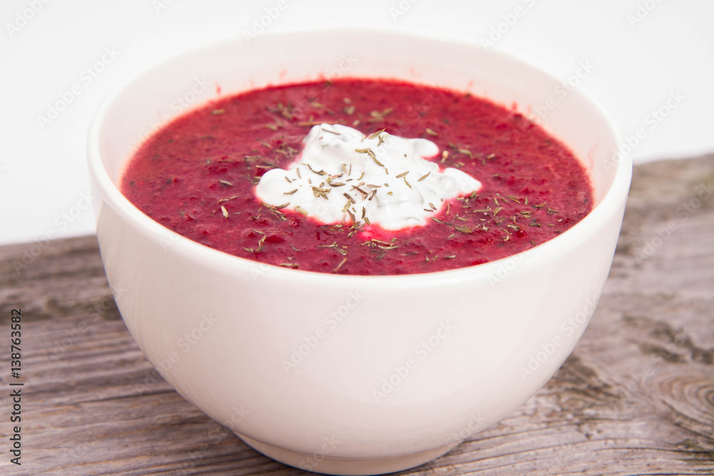 Beetroot cream soup decorated with yoghurt mixed with chives Beetroot cream soup decorated with yoghurt mixed with chives
