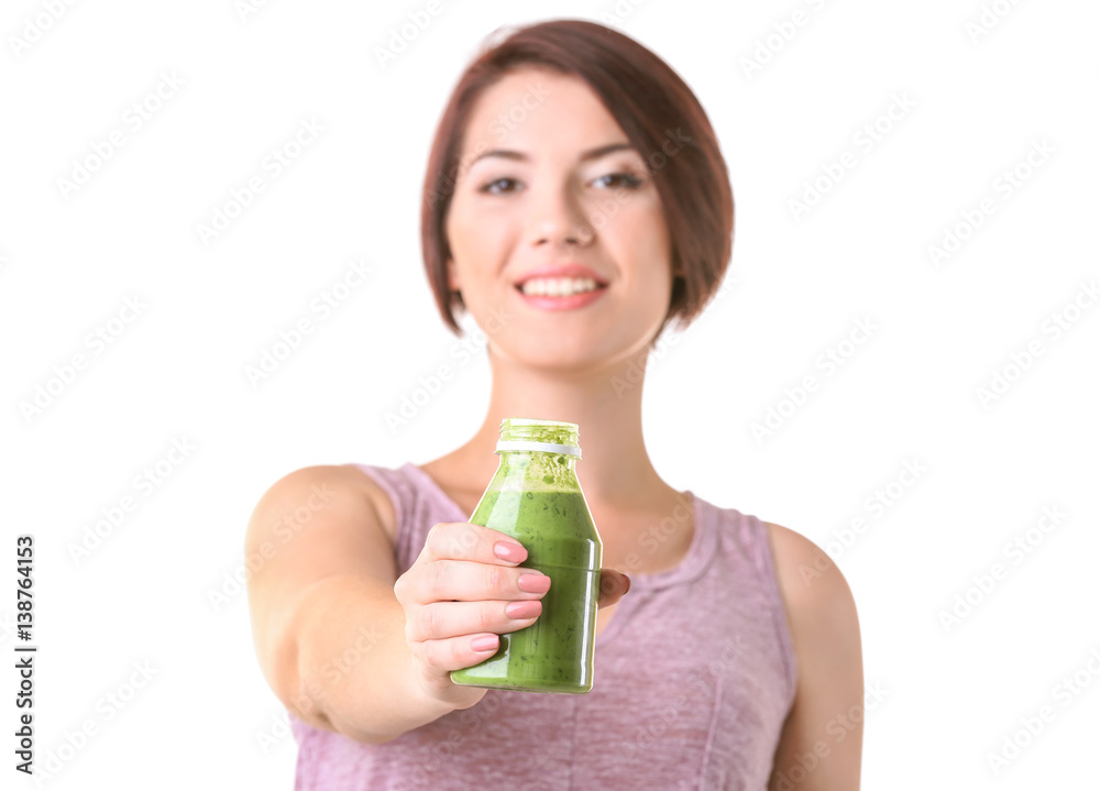 Young beautiful woman with green smoothie on light background Young beautiful woman with green smoothie on light background