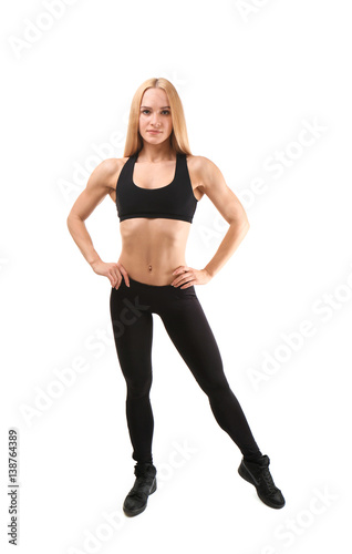 Young athletic woman isolated on white