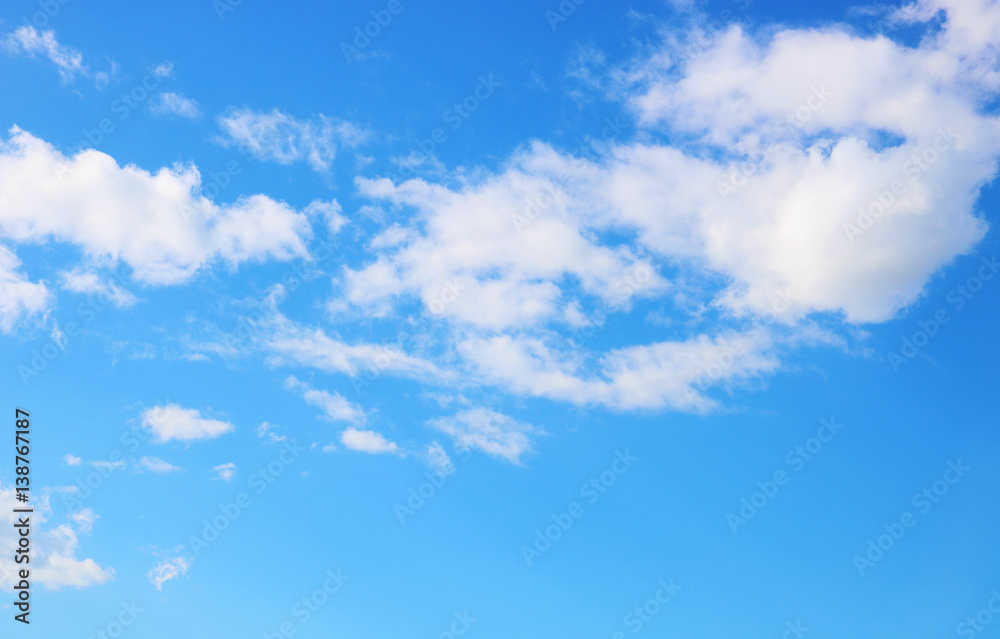 Gorgeous summertime white clouds in the blue sky 