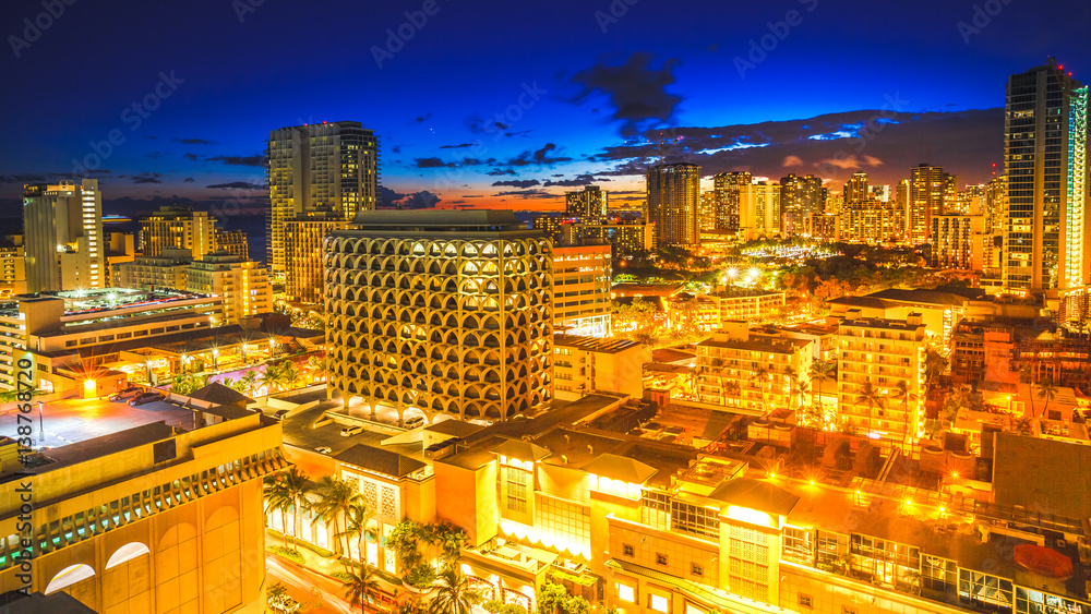 Aerial view night life of Waikiki skyline in Oahu island Hawaii, United States. City night lights and nightlife concept.