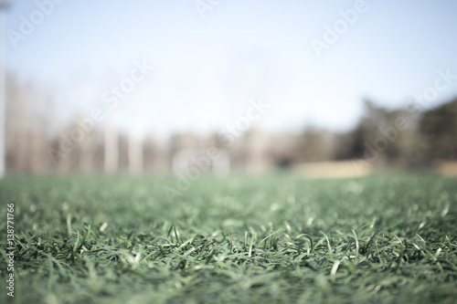 the artificial grass football ground : for usage of background, intentionally defocused.