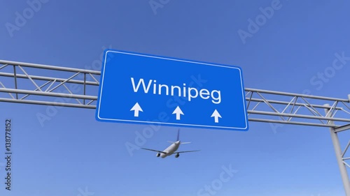 Commercial airplane arriving to Winnipeg airport. Travelling to Canada conceptual 4K animation photo