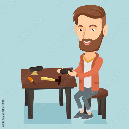 Shoemaker making handmade shoes in workshop.