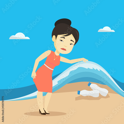 Woman showing plastic bottles under sea wave.