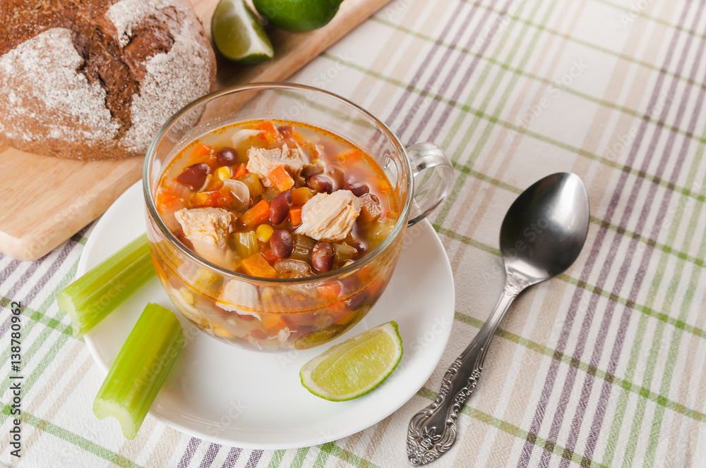 Mexican soup with chicken, celery and vegetables