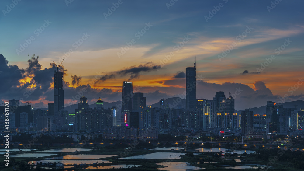 Skyline of Shenzhen City, China at dusk. Viewed from Hong Kong border