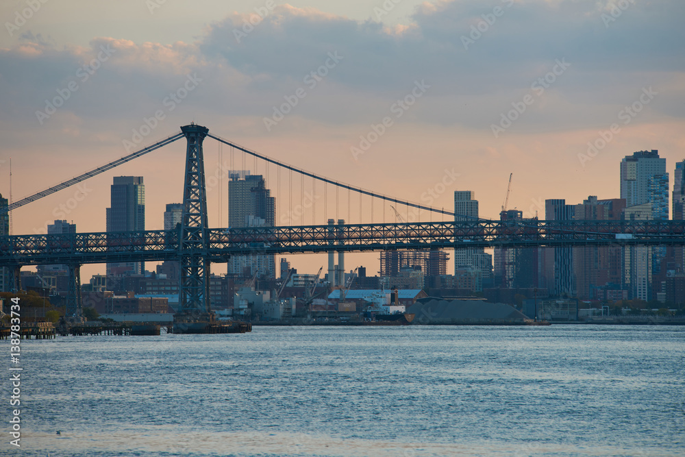 Manhattan bridge and skyline view from water Manhattan bridge and skyline view from water
