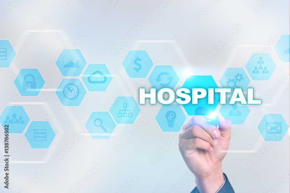 Medical doctor drawing hospital on the virtual screen. Medical doctor drawing hospital on the virtual screen.