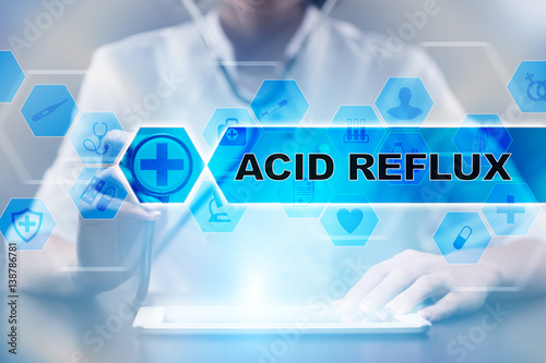 Medical doctor using tablet PC with acid reflux medical concept.