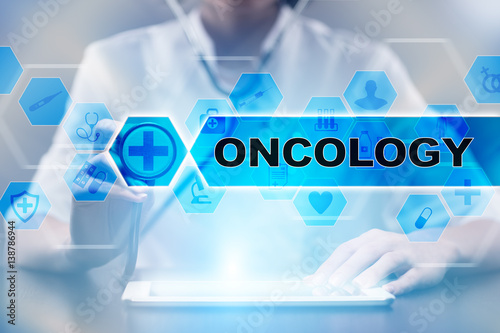 Medical doctor using tablet PC with oncology medical concept. photo