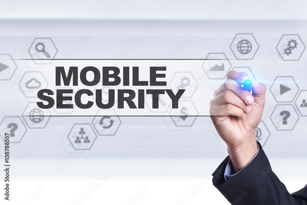Businessman drawing on virtual screen. mobile security concept. Businessman drawing on virtual screen. mobile security concept.